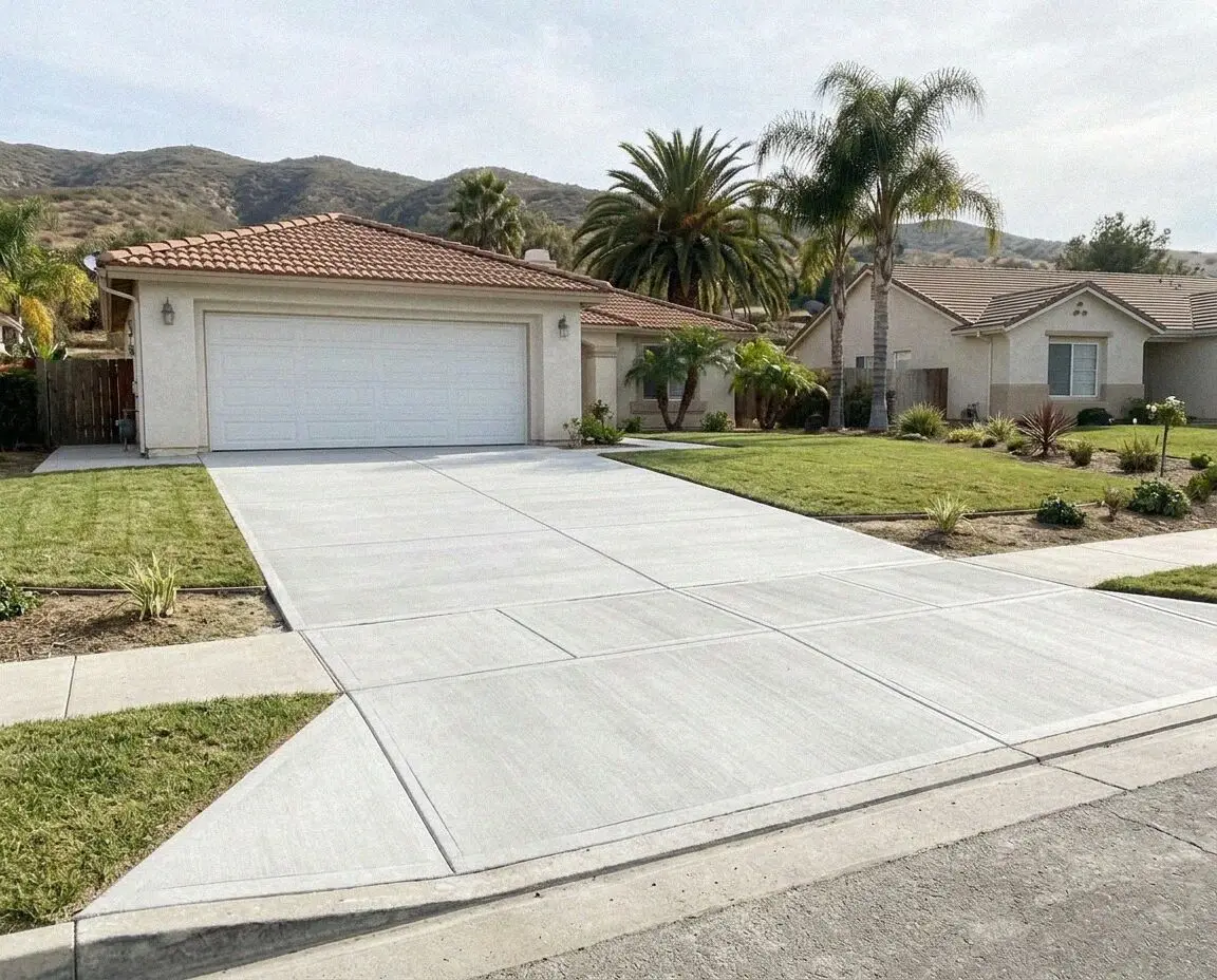 Newly poured concrete driveway running to a Jurupa Valley home